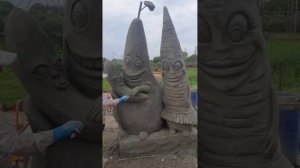 скульптура груши  и  морковки из  арт бетона.