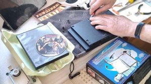 Обслуживание игровой консоли Sony PlayStation 2 slim.