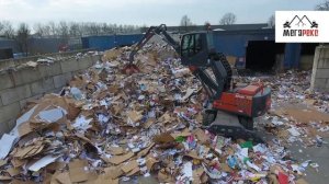 Перегружатель ATLAS 180 MH на мусороперерабатывающем заводе.