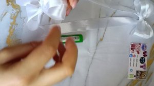 Как сделать бантик из атласной ленты?
