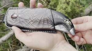 Складной нож "Носорог": сталь - булатная; рукоять - черный граб; инкрустация ; формовочные ножны