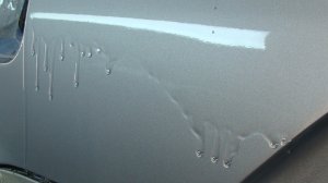 Убрать подтек по лаку