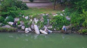 33696435_MotionElements_view-of-fishermen-near-the-river-fishing_preview