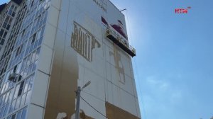 На дом по адресу ул. 1-я Набережная, 68 наносят мурал