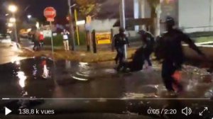 Antifa black bloc militant is tackled directly into a large puddle by federal officers at the Portla
