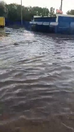 Петровская набережная в воде из-за дождя.