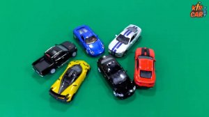 Машинки игрушки - красная машина, желтый спорткар, черный внедорожник. Кир Кар Тойс