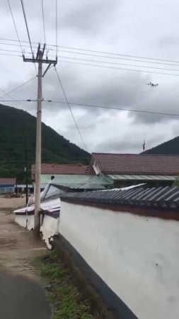 Спасательная операция с помощью дронов во время наводнения в округе Цзиань (Гирин, Китай)