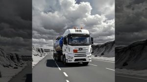 The_blue_tanker_truck,_similar_to_the_one_in_the_image,_is_driving