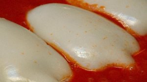 Кальмары, фаршированные курицей и грибами