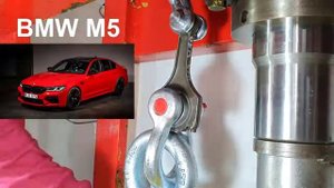 HYDRAULIC PRESS AGAINST BMW CONNECTING RODS.