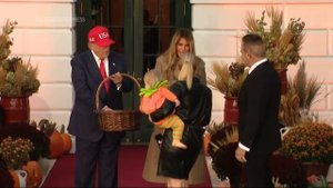 Donald and Melania Trump hand out candy at White House Halloween event