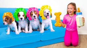 Майя кормит четырёх милых щенков на кровати