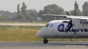 Турбовинтовой Бомбардье DHC-8-402 авиакомпании Qazaq Air приземляется в аэропорту Алматы.