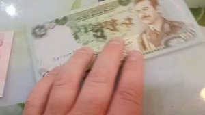 Иракский диктатор Саддам Хусейн на денежных знаках
