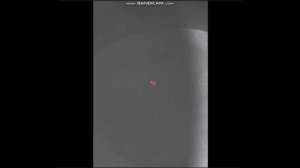 Святящейся НЛО на фоне Луны