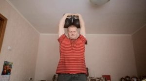 Руки с гирями по 16 кг