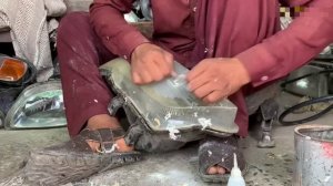 Восстановление автомобильной фары. Пакистанец за работой.