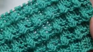 Объёмный рельефный узор спицами с шишечками: простой рисунок для свитера, шарфа и снуда