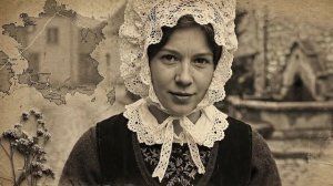 Breton woman portrait, lace coiffe, black wool dress, old village street