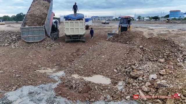 Complete Stones Fill Flooded Lowland For Building And Foundation Work By Skilled Dozer & Dump Trucks смотреть онлайн