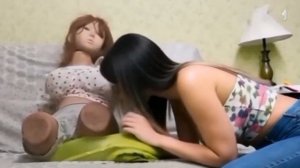 Girl blow pillow under doll