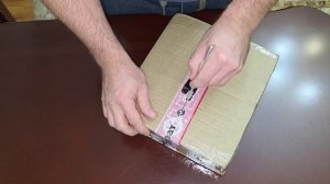 Распаковка заливного шланга для стиральной машины.