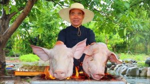 Тушеные на углях две гигантские свиные головы, которые выглядят потрясающе аппетитно! Кухня Китая