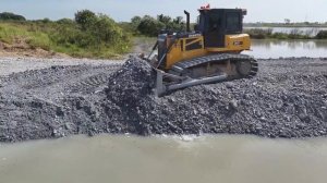 Great!! The project is almost complete, many trucks of stone are waiting with bulldozers pushing.