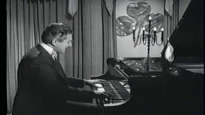 Liberace playing I'm Looking Over a Four Leaf Clover (1)
