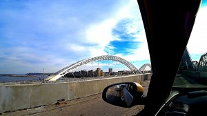 Через аварийный мост.