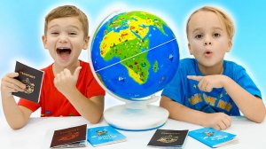 Крис и Майкл изучают мир и страны с глобусом Orboot Земля.