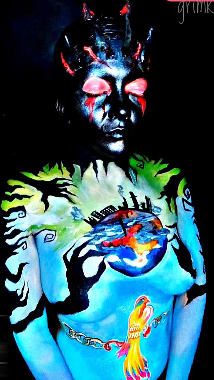 На её теле-карта падшего ангела, Земли, и человек-её палач. Но внутри её Жар-птица, ожидающая возрож