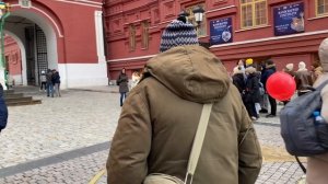 Moscow Street Life Scenes. Windy Sunday. Street performance on Manezhnaya Square.