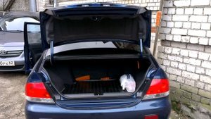 пружинка в багажник лансер 9