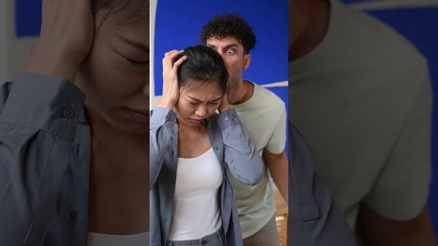 Angry Man Screaming at a Woman Covering her Ears