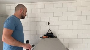 Installing a stainless steel Kitchen Hood.
