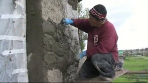 оформление  фасада  дома  декоративная  штукатурка  из  арт  бетона  под  камень.