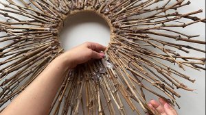 Idea of decorating a mirror from wooden sticks
