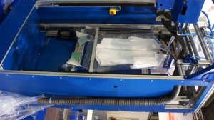 Автоматизированный упаковщик одежды для прачечной