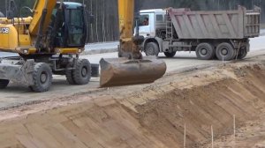 Профессиональная планировка ковшом (откосы)