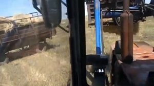 Т 150К и ЮМЗ 6АКЛ с пку 0.8. Погрузка рулонов сена
