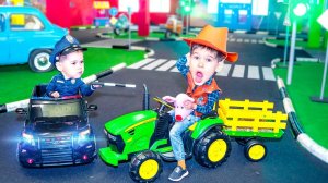 Ride on Power Wheels Cars at Amusement Park.