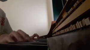 Old doll on a completely broken and out of tune piano