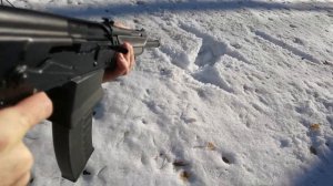 Shotgun Saiga 12 writing text in the snow