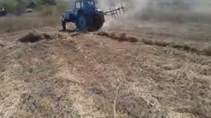 Трактор с граблями