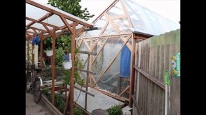 Теплица из дерева, стекла и пленки. / Greenhouse made of wood, glass and film.