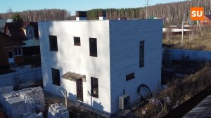 Обзор двухэтажного дома из газобетона с плоской кровлей по проекту Сумароково