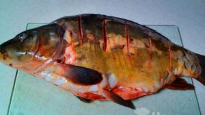 Карп запеченный в духовке