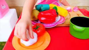 Nastya cooks unusual food for dad in the toy kitchen